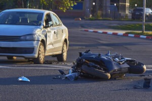 Damaged Vehicle Next To Damaged Motorcycle After A Collision In Oklahoma