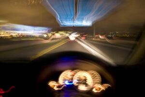 driver-speeding-down-the-highway