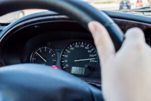 person behind steering wheel