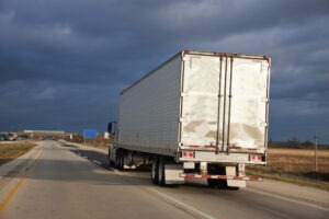 semi-truck nearing a storm