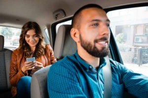 woman-on-her-phone-in-an-Uber