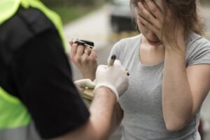 woman-taking-a-breathalyzer-test