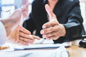 attorney and client about to shake hands