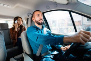 driver and female passenger talking