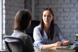 female client talking to lawyer