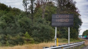 sign warning motorists of crash