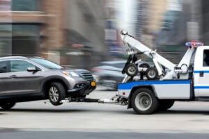 tow-truck-speeding-with-car