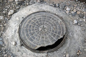 broken manhole cover