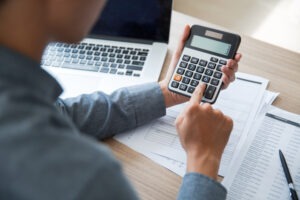 man using calculator