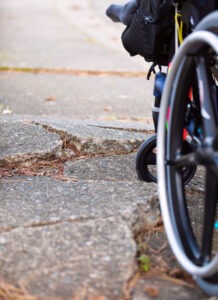 wheelchair wheel stuck in large cracks