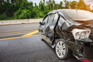 crunched-up black car