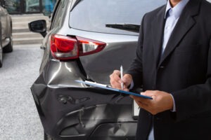 insurance agent reporting car damage