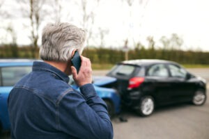 older man calling for help at accident scene