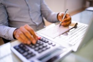 person writing a check for a client