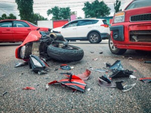 smashed-up red motorcycle