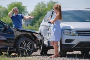 woman-and-man-arguing-after-car-crash