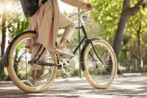 bicycle closeup on feet of a casual cyclist