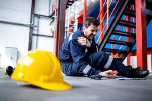 man hurt at work on floor