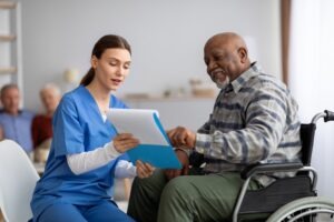 nurse-helping-patient-understand-social-security-docs