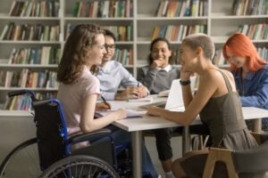 woman in wheelchair at library meeting