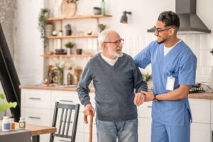 young male nurse with nursing home patient