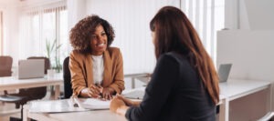 woman speaking with attorney